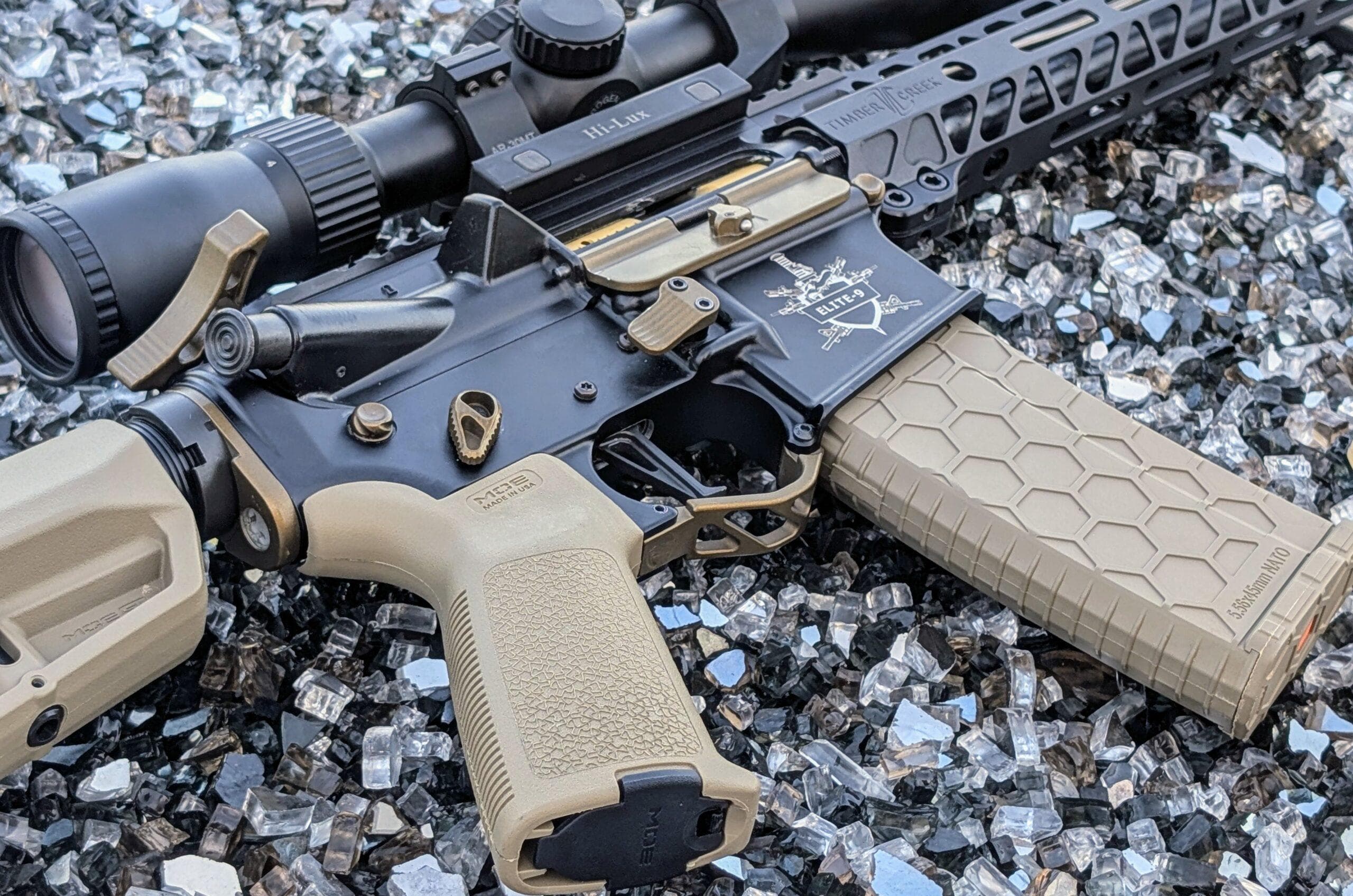 Premium firearms displayed on a gun shop wall — Sig Sauer, Glock, and Smith & Wesson